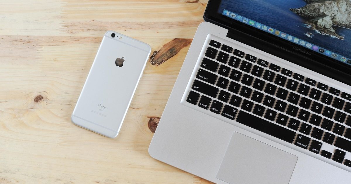 Laptop, mobile phone, table, phone, iphone, macbook, computer, device, apple, technology, desk, workplace, workspace, office, closeup, mobile phone, phone, iphone, iphone, iphone, iphone, iphone, office